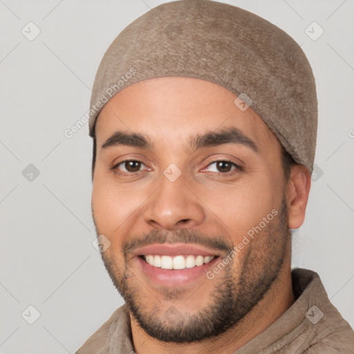 Joyful white young-adult male with short  black hair and brown eyes