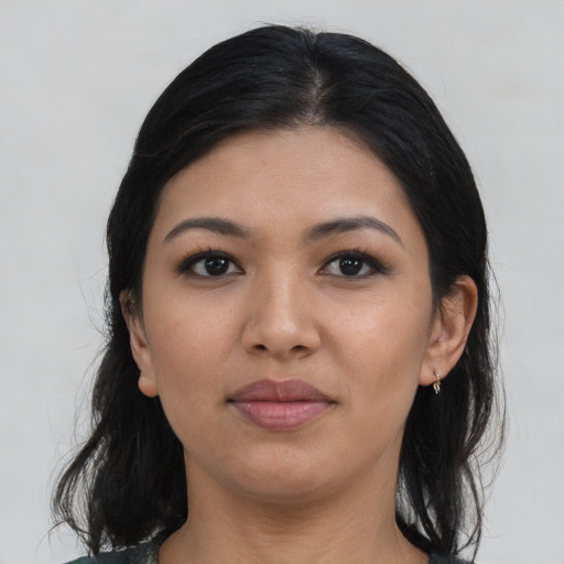 Joyful asian young-adult female with long  black hair and brown eyes