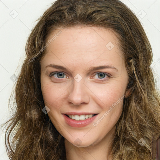 Joyful white young-adult female with long  brown hair and green eyes