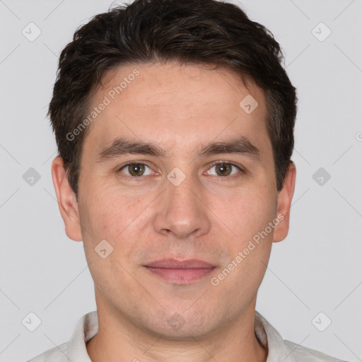 Joyful white adult male with short  brown hair and brown eyes