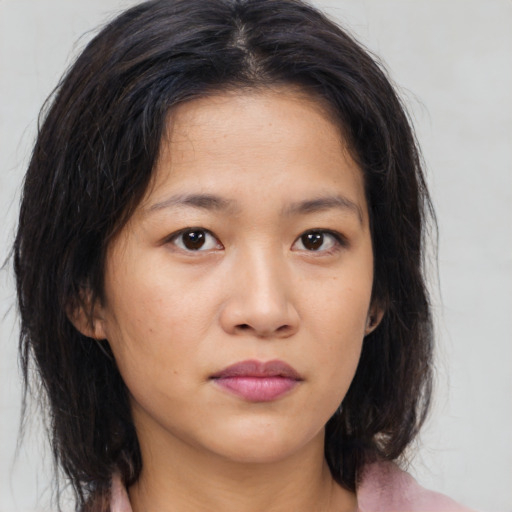 Neutral asian young-adult female with medium  brown hair and brown eyes