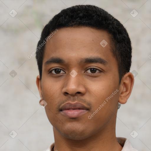 Neutral latino young-adult male with short  black hair and brown eyes