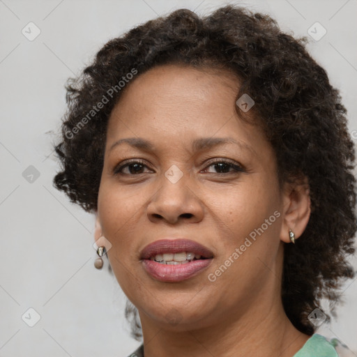 Joyful black adult female with short  brown hair and brown eyes