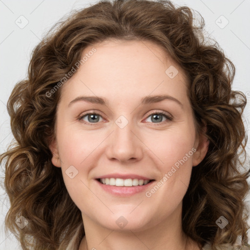 Joyful white young-adult female with long  brown hair and green eyes