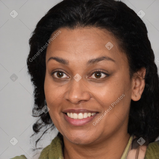 Joyful black adult female with medium  brown hair and brown eyes