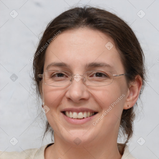 Joyful white adult female with medium  brown hair and brown eyes