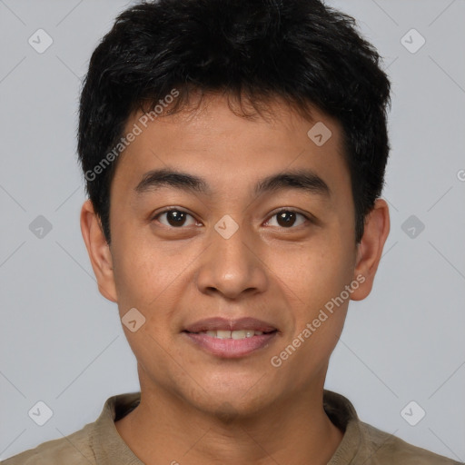 Joyful asian young-adult male with short  brown hair and brown eyes