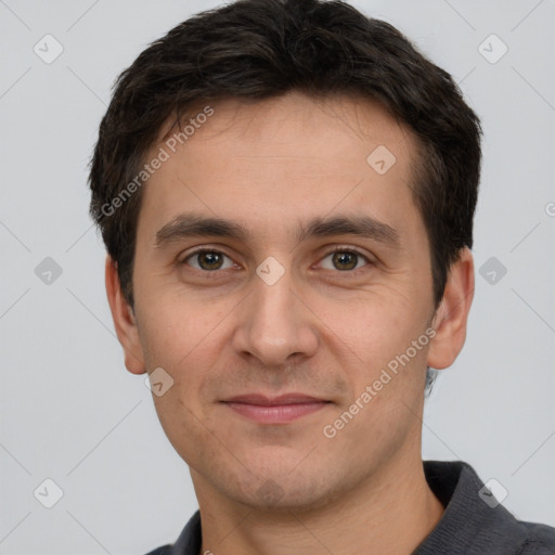 Joyful white young-adult male with short  brown hair and brown eyes