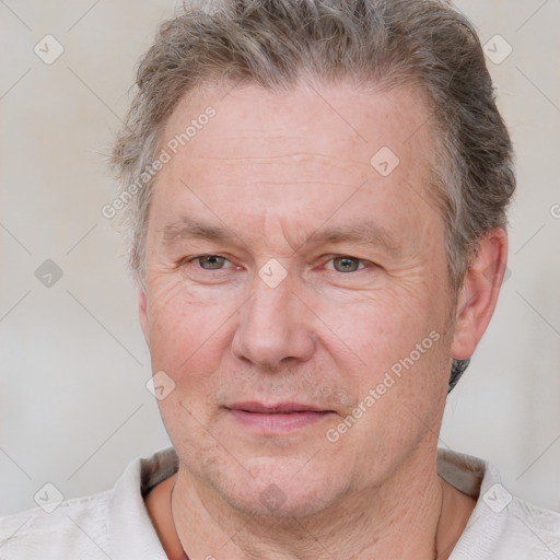 Joyful white adult male with short  brown hair and grey eyes