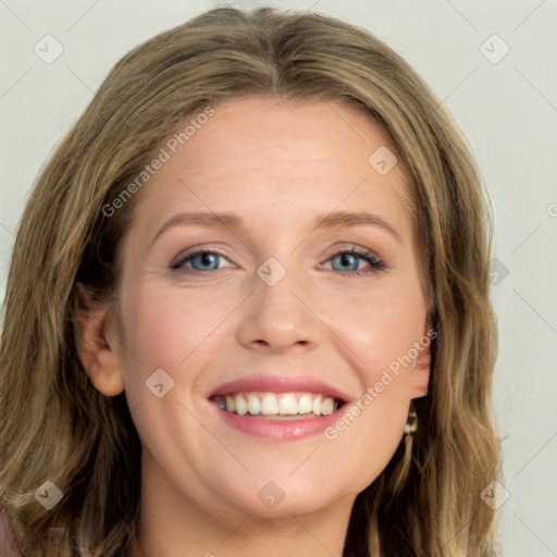 Joyful white young-adult female with long  brown hair and blue eyes