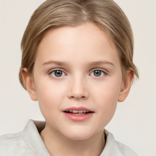 Joyful white child female with short  brown hair and grey eyes