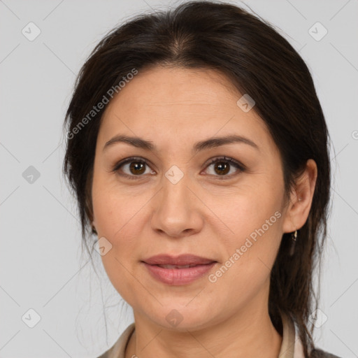 Joyful white adult female with medium  brown hair and brown eyes