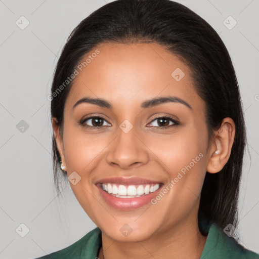 Joyful latino young-adult female with long  brown hair and brown eyes