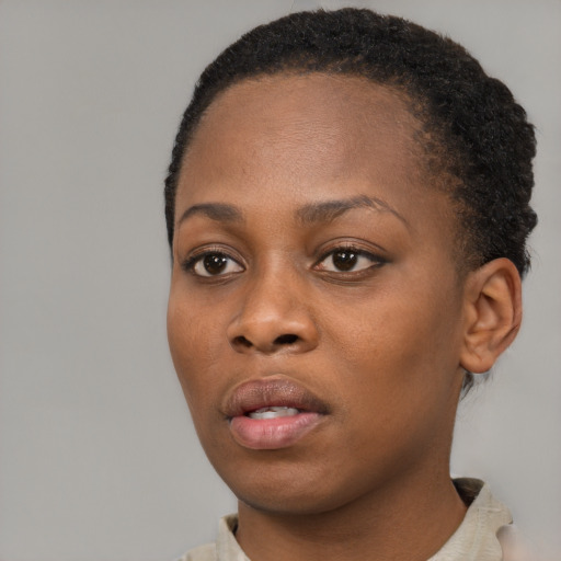 Neutral black young-adult female with short  black hair and brown eyes