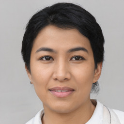 Joyful asian young-adult female with short  black hair and brown eyes