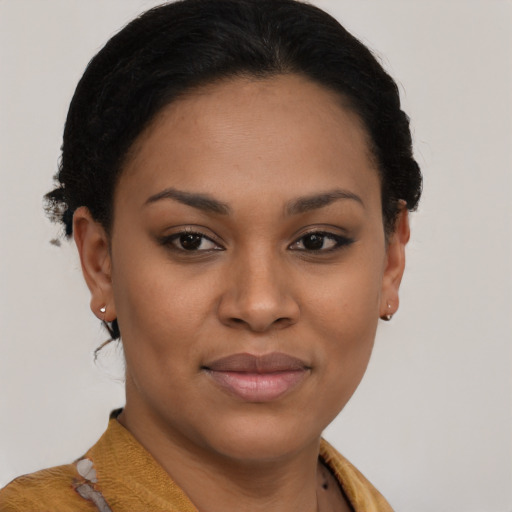Joyful black young-adult female with short  brown hair and brown eyes
