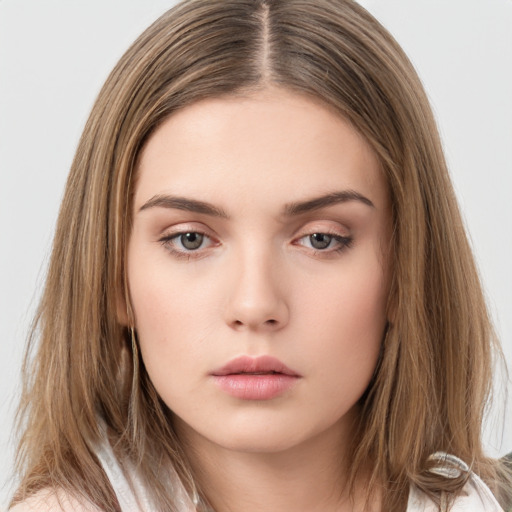 Neutral white young-adult female with long  brown hair and brown eyes