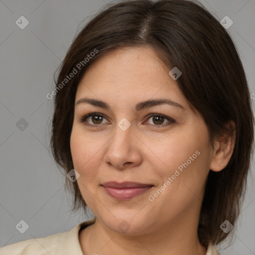 Joyful white adult female with medium  brown hair and brown eyes