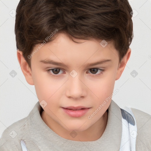 Joyful white child male with short  brown hair and brown eyes