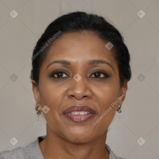 Joyful black adult female with short  brown hair and brown eyes