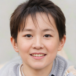 Joyful white child female with short  brown hair and brown eyes