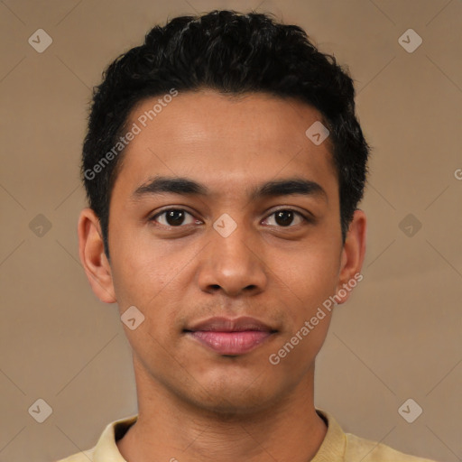 Joyful latino young-adult male with short  black hair and brown eyes