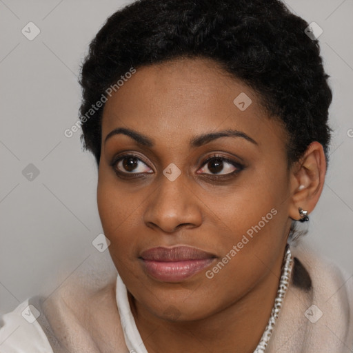 Joyful black young-adult female with short  brown hair and brown eyes