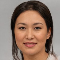 Joyful asian young-adult female with medium  brown hair and brown eyes