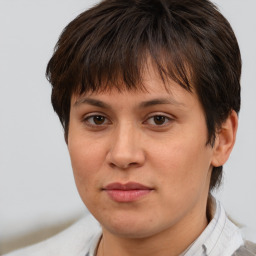 Joyful white adult female with short  brown hair and brown eyes