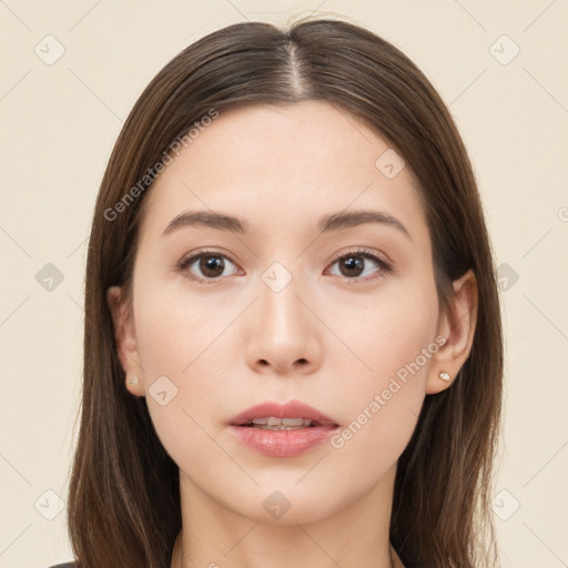 Neutral white young-adult female with long  brown hair and brown eyes