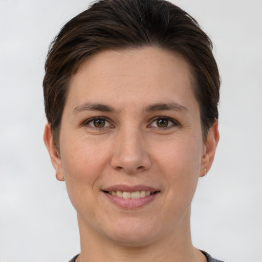 Joyful white young-adult female with short  brown hair and brown eyes