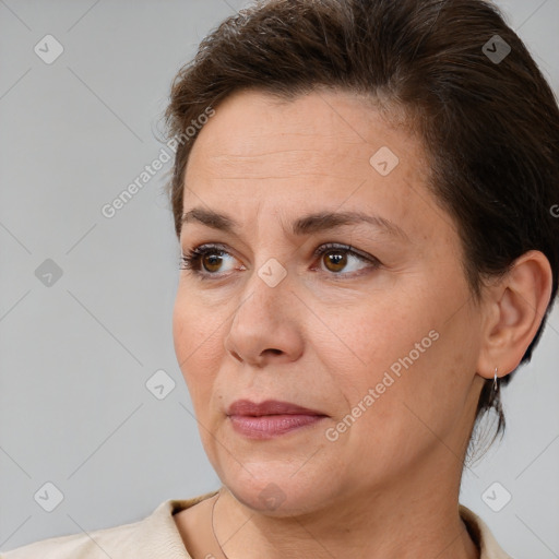 Joyful white adult female with short  brown hair and brown eyes