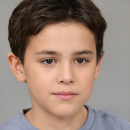 Joyful white child male with short  brown hair and brown eyes