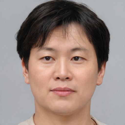 Neutral asian young-adult male with short  brown hair and brown eyes
