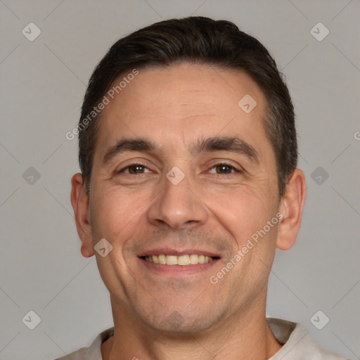 Joyful white adult male with short  brown hair and brown eyes