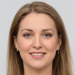 Joyful white young-adult female with long  brown hair and grey eyes