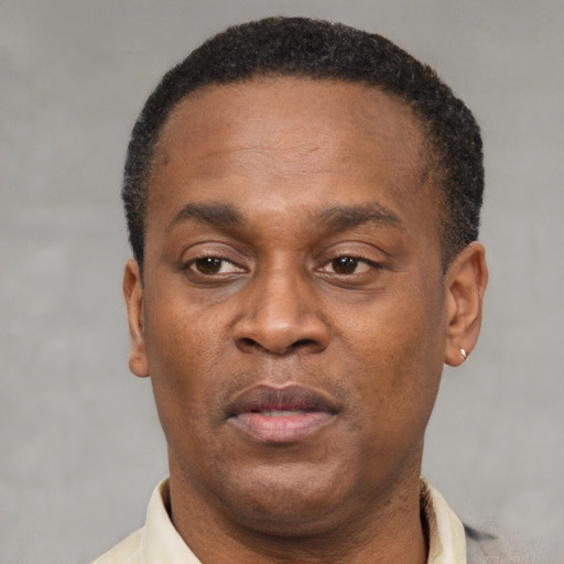 Neutral latino adult male with short  brown hair and brown eyes