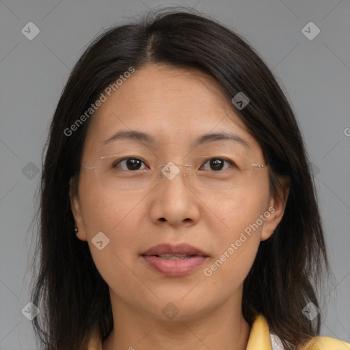 Joyful white adult female with medium  brown hair and brown eyes