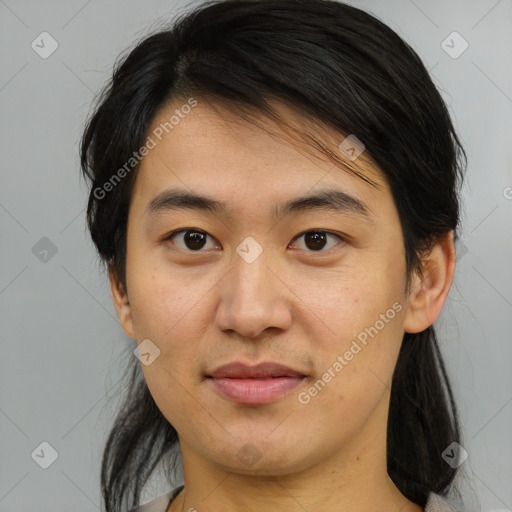 Joyful asian young-adult male with medium  brown hair and brown eyes