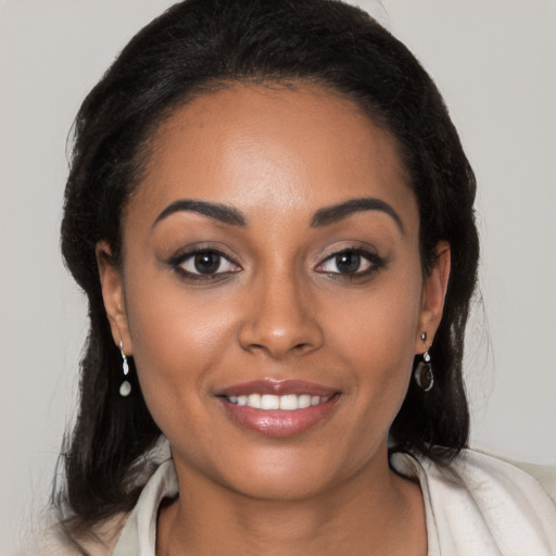 Joyful latino young-adult female with medium  black hair and brown eyes