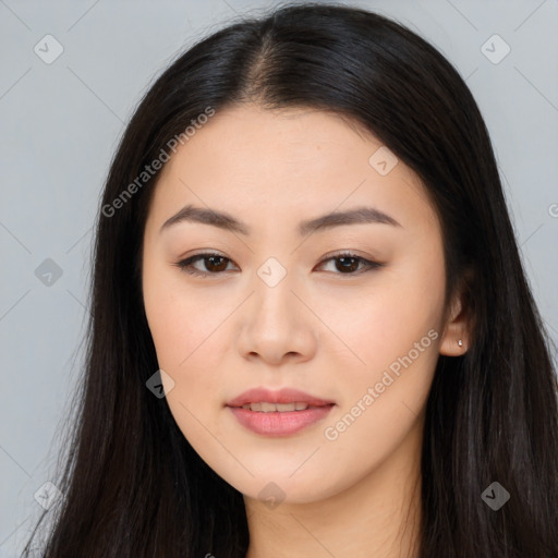 Joyful asian young-adult female with long  black hair and brown eyes