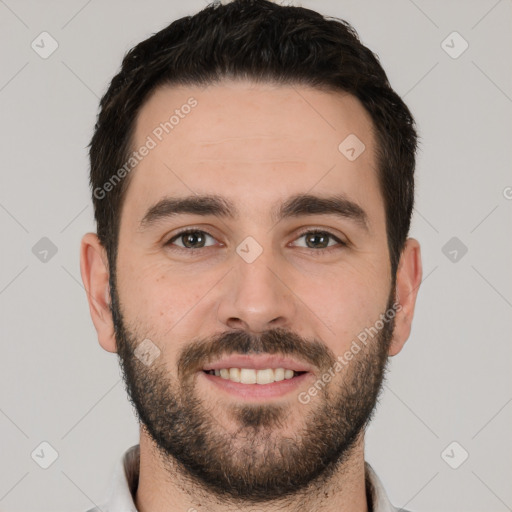 Joyful white young-adult male with short  black hair and brown eyes