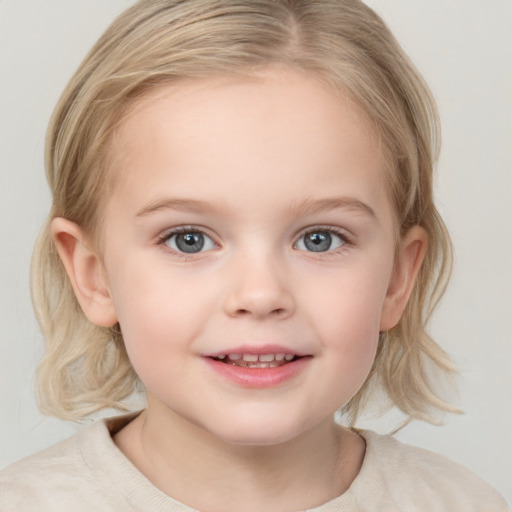 Joyful white child female with medium  blond hair and blue eyes