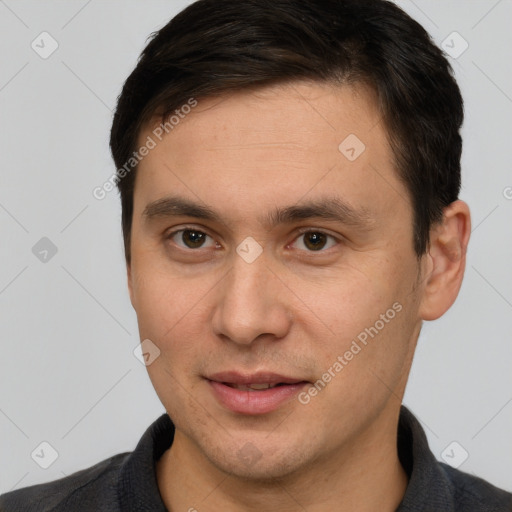 Joyful white young-adult male with short  brown hair and brown eyes