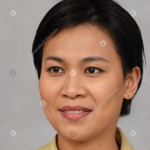 Joyful asian young-adult female with medium  brown hair and brown eyes