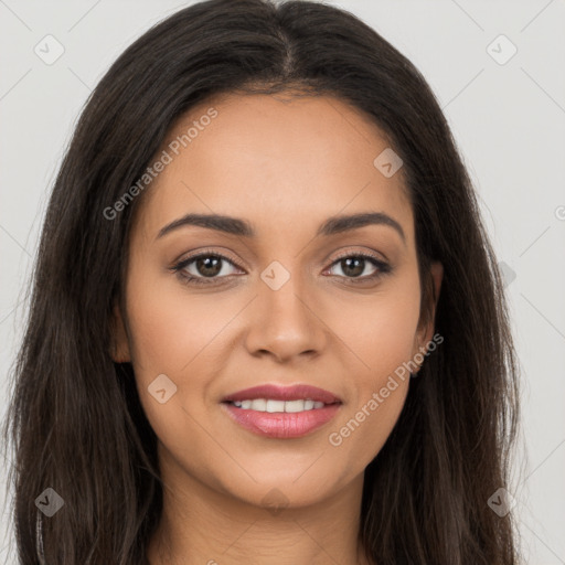 Joyful latino young-adult female with long  brown hair and brown eyes