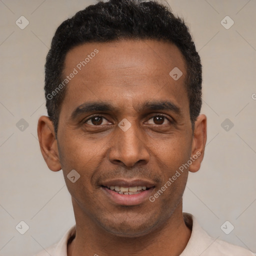 Joyful latino adult male with short  black hair and brown eyes