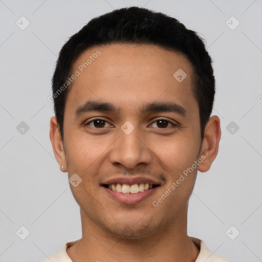 Joyful latino young-adult male with short  black hair and brown eyes