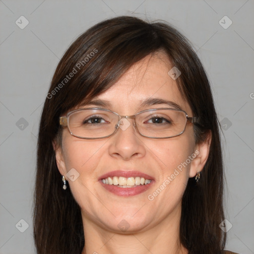 Joyful white adult female with medium  brown hair and blue eyes