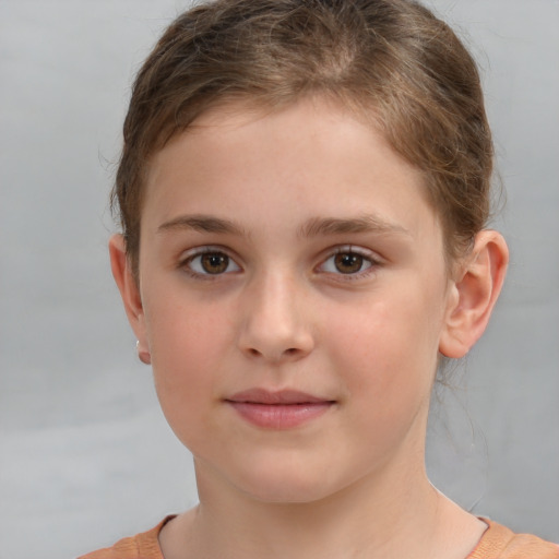 Joyful white child female with short  brown hair and brown eyes